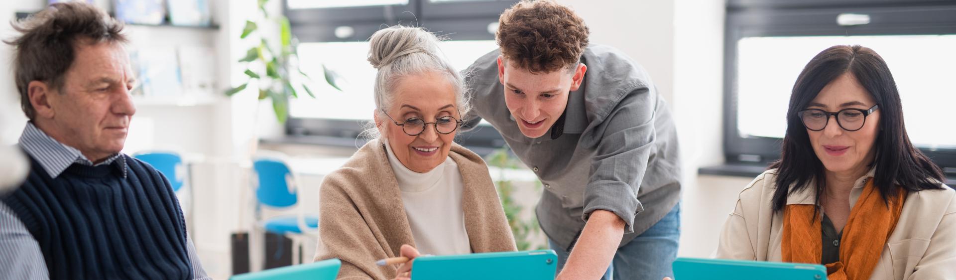 A group of seniors using tablets.