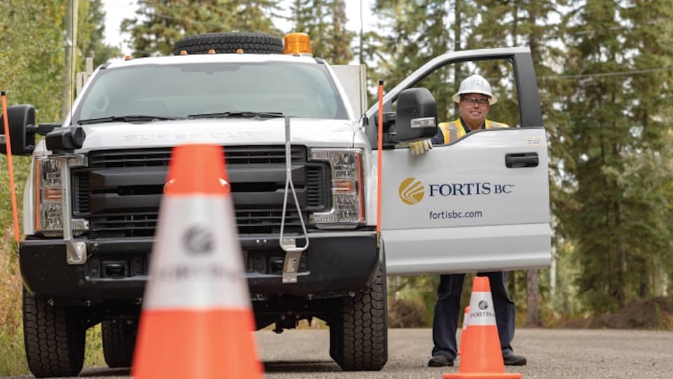 FortisBC worker in a work truck
