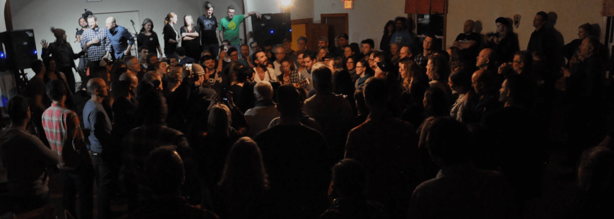 Band playing in crowded hall